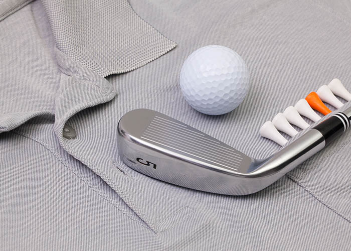 grey polo shirt and golf equipment