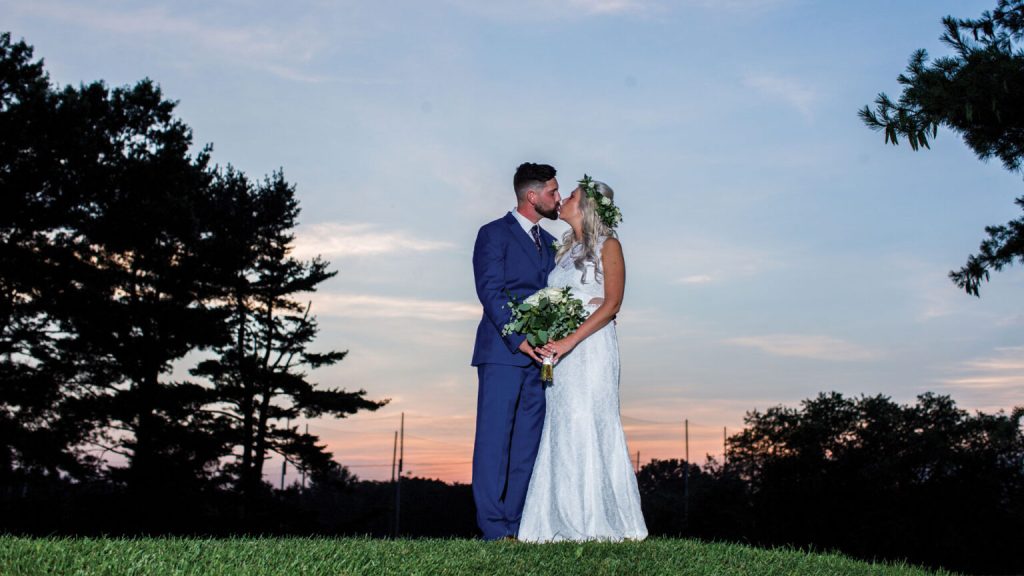 bride and groom out on the course