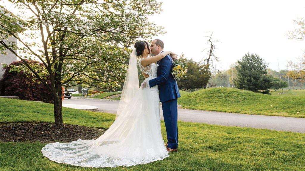 bride and groom out on the course