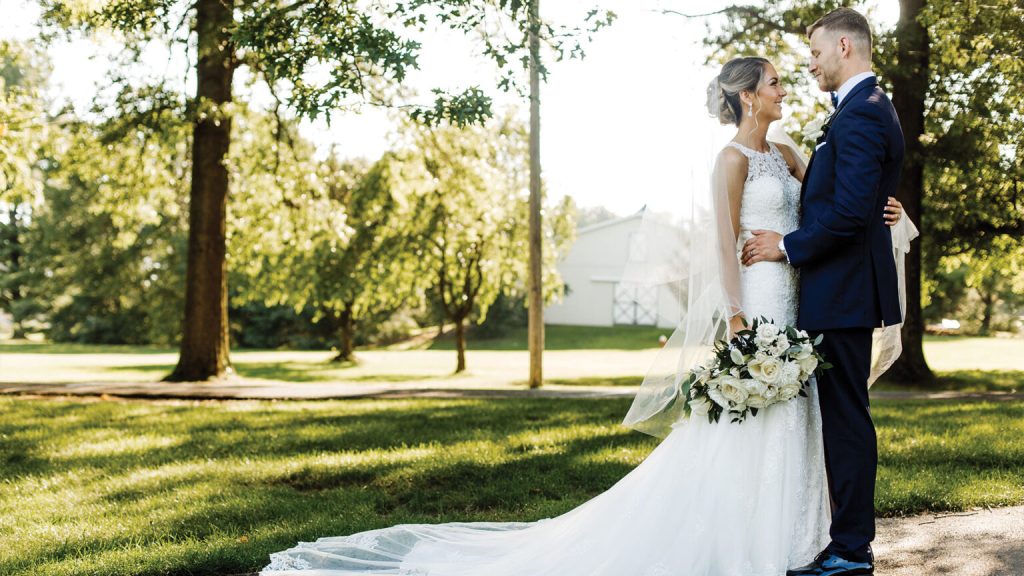 bride and groom out on the course