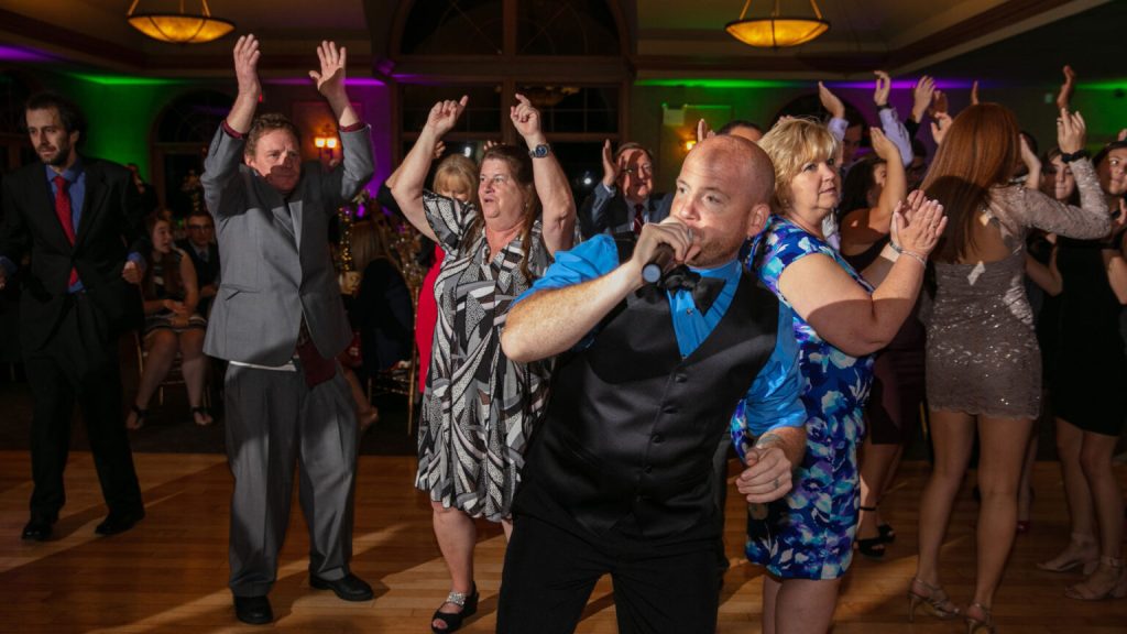 MC on the mic at the reception