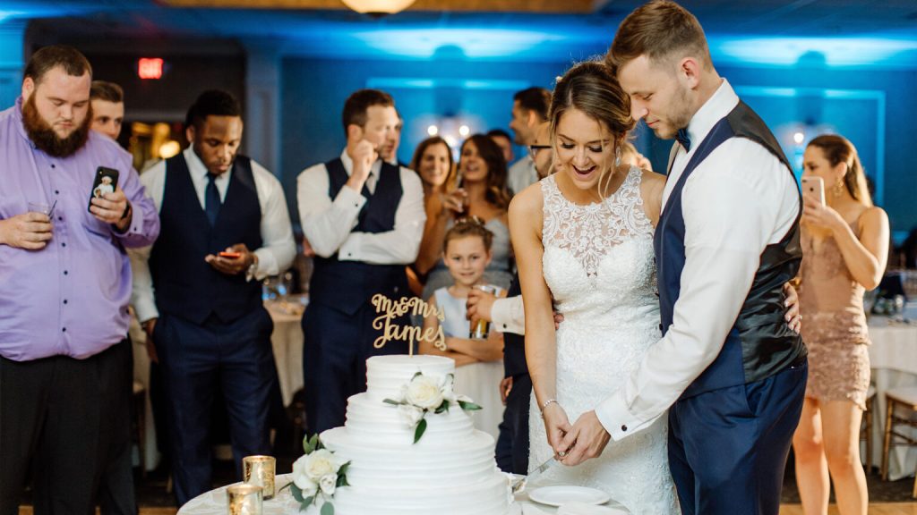 bride and groom cutting a wedding cake